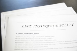 a life insurance policy pile of papers