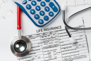 Life insurance application form with banknote and stethoscope concept for life planning